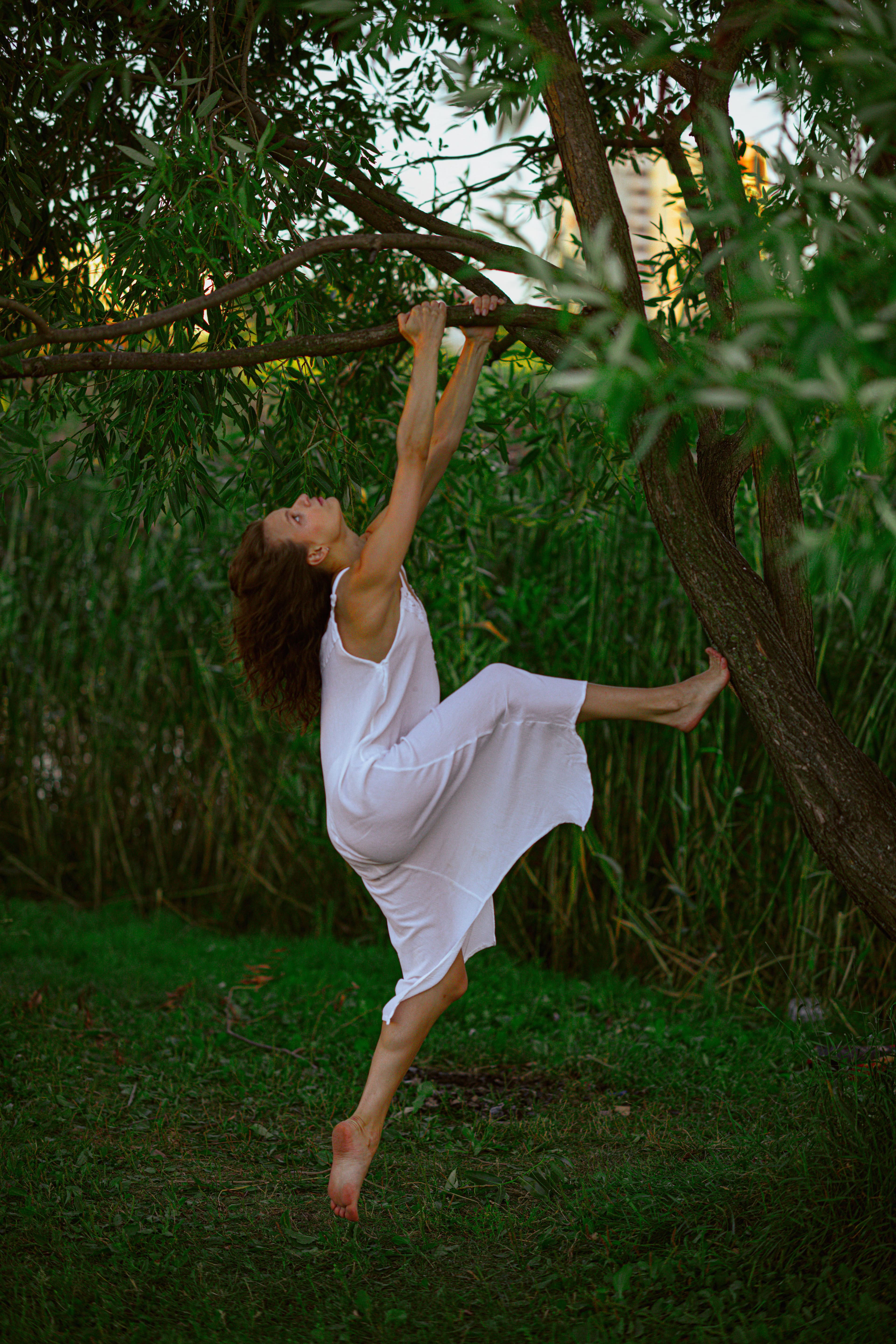 Woman moving outdoors among trees